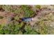 Aerial view shows a house nestled among mature trees on a spacious lot at 285 Glen Ne Rd, Conyers, GA 30013