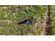 A stunning aerial view features a private pond nestled among mature trees at 285 Glen Ne Rd, Conyers, GA 30013