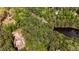 Aerial view of land with a pond, mature trees, and building site at 285 Glen Ne Rd, Conyers, GA 30013