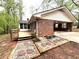 Rear exterior featuring a wood deck and a convenient carport at 285 Glen Ne Rd, Conyers, GA 30013