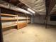 Unfinished basement providing ample storage space with wooden shelves at 285 Glen Ne Rd, Conyers, GA 30013