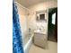 Bathroom with tub and shower combination and vanity with ample lighting at 285 Glen Ne Rd, Conyers, GA 30013