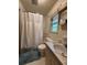 Bathroom featuring a toilet, bath, and shower with a white curtain at 285 Glen Ne Rd, Conyers, GA 30013