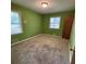 Spacious bedroom features two large windows and green walls at 285 Glen Ne Rd, Conyers, GA 30013