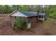Rear exterior view of a brick home featuring a screened-in porch at 285 Glen Ne Rd, Conyers, GA 30013