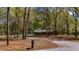 Charming home with mature trees, landscaping, and long driveway at 285 Glen Ne Rd, Conyers, GA 30013