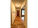 Inviting hallway featuring hardwood floors, light walls, and a dark wood front door at 285 Glen Ne Rd, Conyers, GA 30013