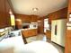 Cozy kitchen with wooden cabinets, a white refrigerator, and countertops at 285 Glen Ne Rd, Conyers, GA 30013