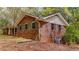 Rear angle of a brick home, set against a wooded backdrop at 285 Glen Ne Rd, Conyers, GA 30013