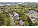 An aerial view showcasing the neighborhood's beautiful tree coverage with a view of the lake in the background at 322 Tupelo Tr Trl, Canton, GA 30114