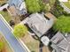 An overhead view of a house with mature trees, and well manicured lawn at 322 Tupelo Tr Trl, Canton, GA 30114