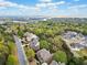 Scenic aerial view of a neighborhood surrounded by lush trees and a distant lake at 322 Tupelo Tr Trl, Canton, GA 30114