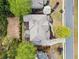 An aerial view showcasing a well-maintained house with lush landscaping, and mature trees at 322 Tupelo Tr Trl, Canton, GA 30114