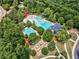 An aerial view of the community pool area with mature trees and landscaping creating a beautiful oasis at 322 Tupelo Tr Trl, Canton, GA 30114