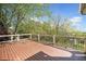 Wide angle view of a home's wood deck with black metal railing at 322 Tupelo Tr Trl, Canton, GA 30114
