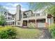 A beautiful home featuring a spacious deck, a screened in porch, and an outdoor kitchen, perfect for entertaining at 322 Tupelo Tr Trl, Canton, GA 30114