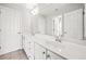 Bright bathroom featuring double sink vanity, and ample storage with tiled floor and neutral tones at 322 Tupelo Tr Trl, Canton, GA 30114