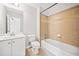 Bright bathroom featuring a combination shower and tub with neutral tile and modern fixtures at 322 Tupelo Tr Trl, Canton, GA 30114