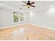 Spacious bedroom with tile floors, crown moulding, ceiling fan, and a large window at 322 Tupelo Tr Trl, Canton, GA 30114
