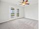 Bedroom featuring new carpet, ceiling fan, and glass doors leading to an outdoor patio at 322 Tupelo Tr Trl, Canton, GA 30114