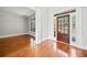 Inviting foyer with gleaming hardwood floors, detailed trim, and a solid wood door with sidelights and transom window at 322 Tupelo Tr Trl, Canton, GA 30114