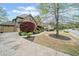 Charming home with a well-manicured lawn, beautiful landscaping, and inviting curb appeal at 322 Tupelo Tr Trl, Canton, GA 30114