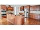 Kitchen featuring center island, stainless steel appliances, and dark wood cabinetry at 322 Tupelo Tr Trl, Canton, GA 30114