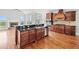 Kitchen island with stainless steel appliances, granite countertops, and wood cabinets at 322 Tupelo Tr Trl, Canton, GA 30114