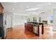 Open-concept kitchen with stainless steel appliances and hardwood floors at 322 Tupelo Tr Trl, Canton, GA 30114