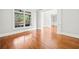 Bright living room with hardwood floors, white walls, and views to the front yard at 322 Tupelo Tr Trl, Canton, GA 30114