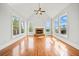 Spacious living room featuring hardwood floors, a vaulted ceiling, and a fireplace at 322 Tupelo Tr Trl, Canton, GA 30114