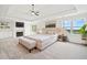 A tastefully decorated main bedroom features a fireplace, tv, and large bed at 322 Tupelo Tr Trl, Canton, GA 30114