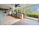 Outdoor kitchen with a pizza oven, built-in grill, and wood flooring at 322 Tupelo Tr Trl, Canton, GA 30114