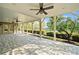 Covered patio featuring an outdoor space perfect for entertaining with ceiling fans and stone floors at 322 Tupelo Tr Trl, Canton, GA 30114