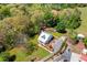 Beautiful aerial view of a home with lush landscaping, a long driveway, and surrounding trees at 4504 Union Hill Rd, Canton, GA 30115
