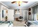 Inviting bedroom featuring twin beds, wainscoting, stylish curtains, and decor at 4504 Union Hill Rd, Canton, GA 30115
