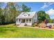 Charming two-story home with a metal roof and manicured lawn and landscaping at 4504 Union Hill Rd, Canton, GA 30115