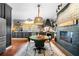 A stylish kitchen with a dining area, a unique brick fireplace, and stainless steel appliances at 4504 Union Hill Rd, Canton, GA 30115
