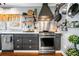 A chef's kitchen with stainless steel appliances, modern fixtures, and ample counter space at 4504 Union Hill Rd, Canton, GA 30115