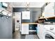 Well-lit laundry room with modern washer and dryer, ample storage, and dark gray walls at 4504 Union Hill Rd, Canton, GA 30115