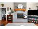 Warm and inviting living room featuring a fireplace, hardwood floors, and a television at 4504 Union Hill Rd, Canton, GA 30115