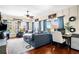 Comfortable living room with a large sofa, wood floors, and lots of natural light at 4504 Union Hill Rd, Canton, GA 30115