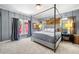 Charming primary bedroom featuring soft gray walls, plush carpeting, and a lovely four-poster bed at 4504 Union Hill Rd, Canton, GA 30115