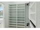 Spacious walk-in closet featuring extensive shelving for organized storage of clothing and personal items at 1332 Nw Creekside Cir, Atlanta, GA 30318