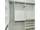 Organized walk-in closet showcasing adjustable shelving, hanging rods, and ample storage for clothes and accessories at 1332 Nw Creekside Cir, Atlanta, GA 30318