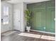 Welcoming entryway with modern door, potted plant, and stylish accent wall at 1332 Nw Creekside Cir, Atlanta, GA 30318