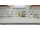 Bright kitchen with white quartz countertops, subway tile backsplash, and decorative gold accents at 1332 Nw Creekside Cir, Atlanta, GA 30318