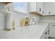Bright kitchen with white quartz countertops, subway tile backsplash, and decorative accents at 1332 Nw Creekside Cir, Atlanta, GA 30318