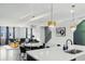 Spacious living area with modern kitchen view, elegant dining table, and stylish furnishings at 1332 Nw Creekside Cir, Atlanta, GA 30318