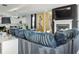 Open living area with stylish gray sofa, fireplace, and modern decor at 1332 Nw Creekside Cir, Atlanta, GA 30318